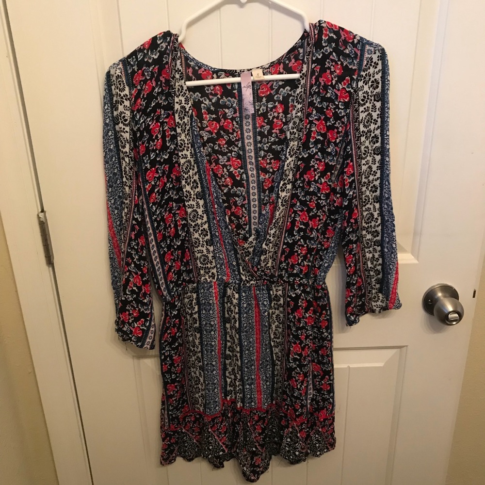 Francesca’s Floral Long Sleeved Romper